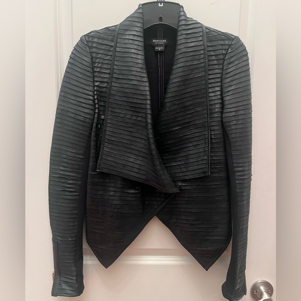 Marciano leather jacket. Stretchy inner sleeve. Size 2. Great condition.